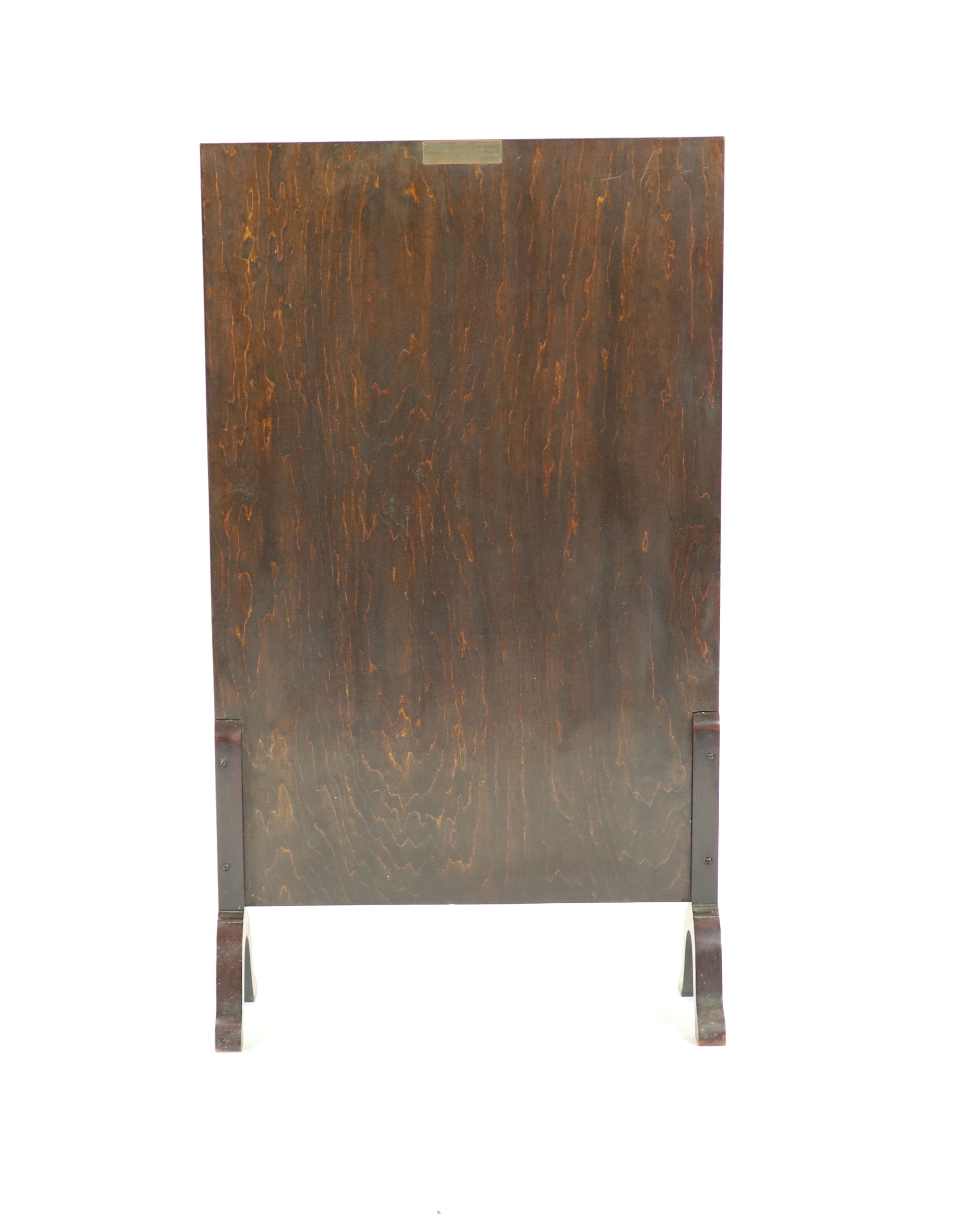 A mahogany cased and glazed embroidered fire screen of Royal interest 108 x 62cm.